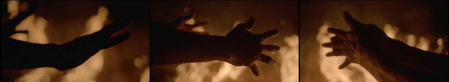 Hands reaching out to a fire